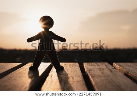 The human model stood on the balcony outside the window looking at the city in the bright sun. Business idea solution and hope.
