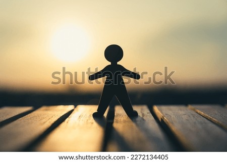 The human model stood on the balcony outside the window looking at the city in the bright sun. Business idea solution and hope.
