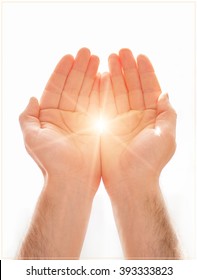 Human open empty hands with palms up. Human hands of prayer. Light from the window