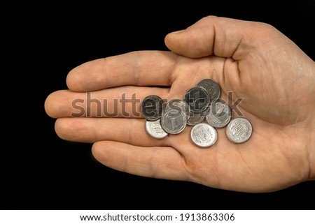 Human palm with small coins. Ukrainian coins in denominations of 1 kopeck. Small pennies in hand. 