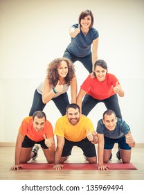 Human Pyramid And Thumbs Up