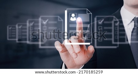 Human resource information system and talent marketplace concept with HR manager scrolling digital resume on virtual screen