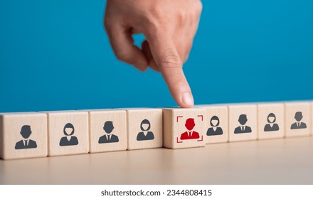 Human resource management, HRM and recruitment for business build team concept. Close up hand choosing man people icons on wooden cube blocks in oblique alignment. Hiring joining career opportunity. - Shutterstock ID 2344808415