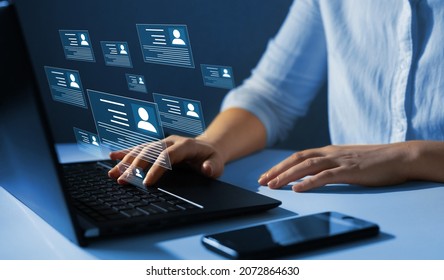 Human resource manager checks the CV online to choose the perfect employee for his business.Online and modern technologies for simplifying the human resources system. HR(human resources) technology. - Shutterstock ID 2072864630