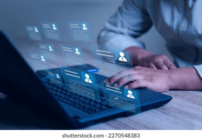 Human resource manager checks the CV online to choose the perfect employee for his business.Online and modern technologies for simplifying the human resources system. HR(human resources) technology. - Shutterstock ID 2270548383