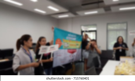 Human resource team or HR team are campaigning "The power of employee voice" activity such as play quiz game for employees in the office, Thailand. Business development concept. Blurred background.