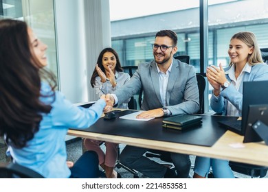 Human resource team talking to a candidate during a job interview in the office. - Shutterstock ID 2214853581