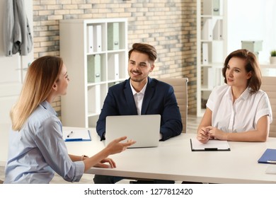 Human resources commission conducting job interview with applicant in office