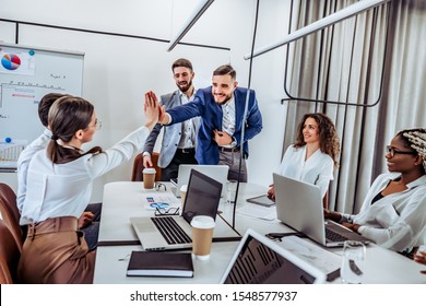 Human Resources Concept. New Accepted Worker Gives High Five To His New Colleague. First Day On Work