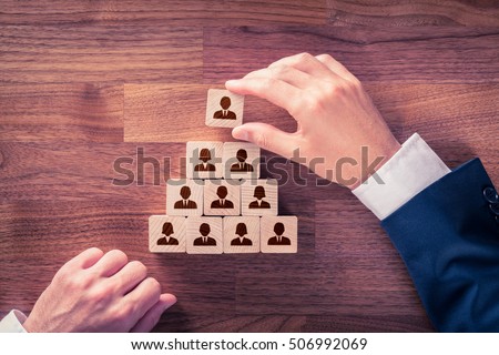 Human resources and corporate hierarchy concept - recruiter complete team by one leader person (CEO) represented by icon.