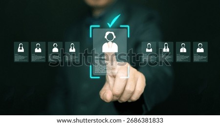 Human resources manager analyzing applicant profiles on virtual screen. Modern concept of digital recruitment, AI candidate selection, HR analytics, and smart hiring technology in business.