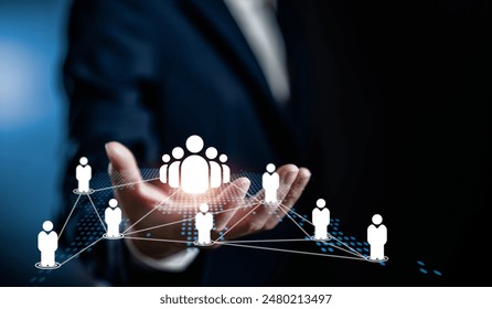 Human Resources Manager holding virtual human icon on world map, HRM, CRM, Recruitment Consultants and Human Resources Management Concepts.
