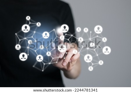 Human resources manager pointing at virtual network chain with person icons. Human capital and teambuilding concept.