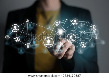 Human resources manager pointing at virtual network chain with person icons. Human capital and teambuilding concept.