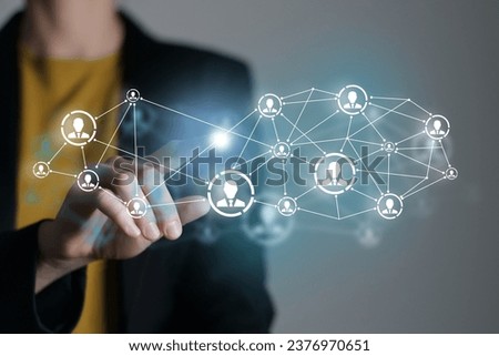 Human resources manager pointing at virtual network chain with person icons. Human capital and teambuilding concept.