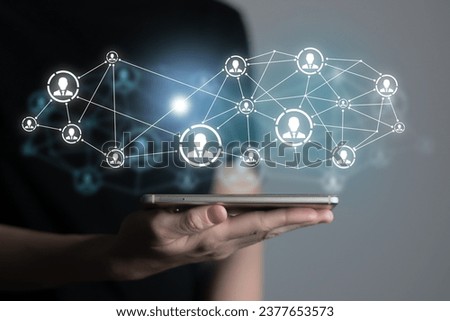 Human resources manager pointing at virtual network chain with person icons. Human capital and teambuilding concept.