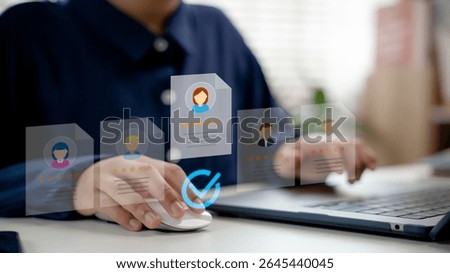 Human resources manager selecting candidate profile on digital interface, HR recruitment process, talent acquisition, online hiring system, and employee evaluation.