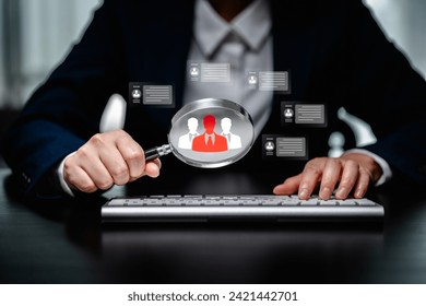 Human Resources Manager using magnifier glass finding with human icons, HRM, CRM, Recruitment Consultants, Headhunter, recruitment agency, Human Resources Management Concepts.