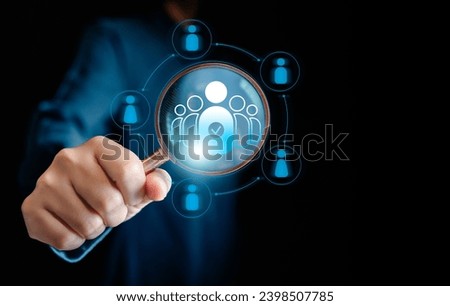 Human Resources Manager using magnifier glass finding with human icons, HRM, CRM, Recruitment Consultants and Human Resources Management Concepts, Headhunting Business, development teamwork leadership