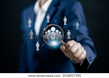 Human Resources Manager using magnifier glass finding to human icons team leader, network human, HRM, CRM, Recruitment Consultants, Headhunter, recruitment agency, Human Resources Management Concepts.