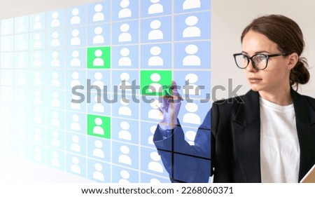 Human resources manager working with digital database of job applicants using virtual screen.
