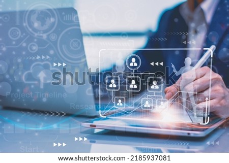Human resources recruitment employment headhunting concept,with officer using smart tablet computer,via futuristic visual interface program technology choose employee,manage and strategy in corporate