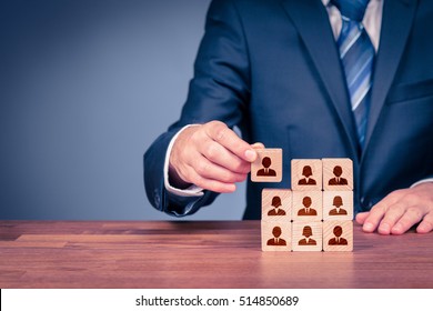 Human Resources, Social Networking, Assessment Center Concept, Personal Audit Or CRM Concept - Recruiter Complete Team By One Person. Employees Are Represented By Wooden Cubes With Icons.