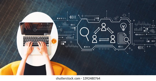 Human resources theme with person using a laptop on a white table - Shutterstock ID 1392480764