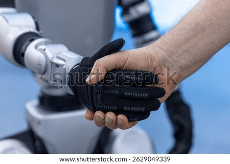 Human robot collaboration future technology synergy industry4.0, Innovative partnership human and robot synergy business, Handshake man and robot machine, Business meet technology