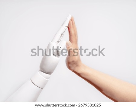 Human and robot hands touching
