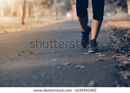 Human running on the park with Close up shoes