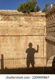 A Human Shadow On A Sunny Wall