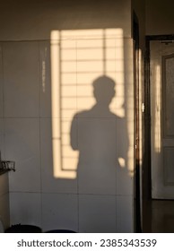 a human shadow on the wall