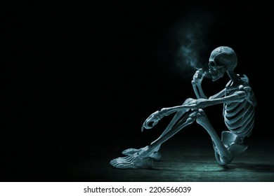 Human skeleton death smoking cigarette
