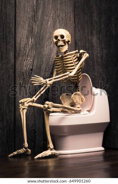 Human Skeleton Figure Sitting On Flush Stock Photo (Edit Now) 649901260