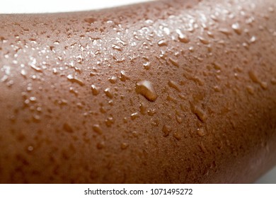 Human Skin, Summer Sweat, Water. Wet skin. Melanin. For exercise, Health and hydration Concept. African American Dark Brown