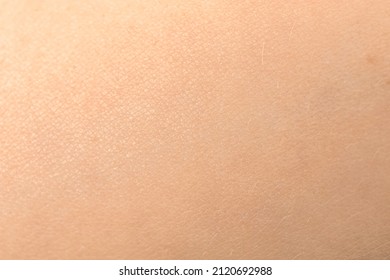 Human skin texture. Detail healthy pink skin background. Young girl, healthcare concept