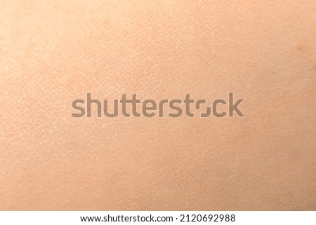 Human skin texture. Detail healthy pink skin background. Young girl, healthcare concept