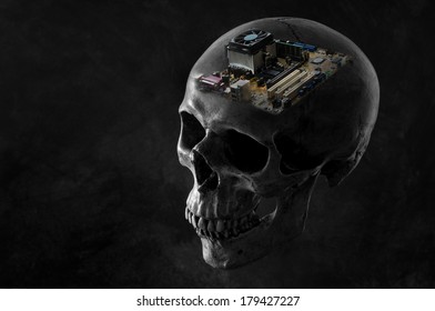 human skull image editing with a computer motherboard on dark background in genius concept ( only skull is black & white version )