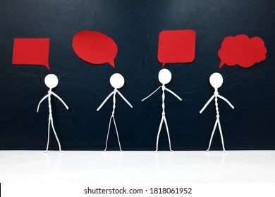 Human stick figure with diverse shape red speech bubbles in dark background. Freedom of expression, individuality and diversity in opinion, ideas and thoughts. - Shutterstock ID 1818061952