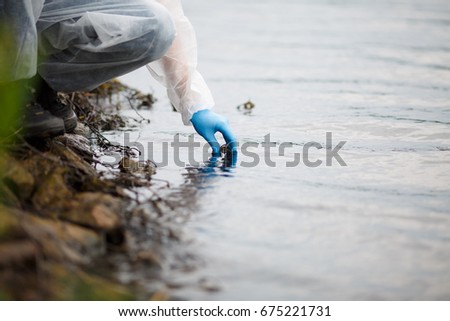 Human takes sample of water
