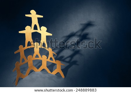 Human team pyramid holding hands