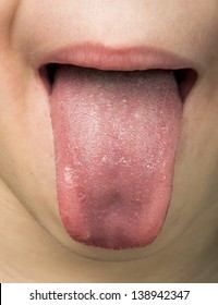 Human Tongue Protruding Out. Child Tongue.