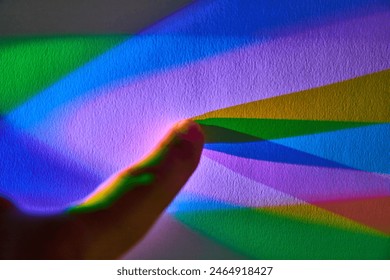 Human Touch in Rainbow Light Dispersion, Close-Up Perspective - Powered by Shutterstock