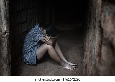 Human Trafficking Concept.Young Girl Sitting In Old Room.teenager Girl Victims Of Trafficking.