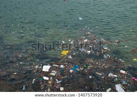 Human trash floating on the sea at Stanley Bay in Hong Kong