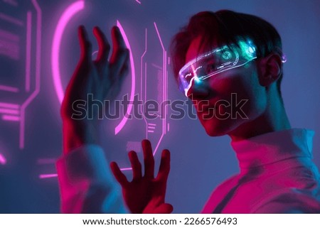 human use hi-tech with holographic graphs and visual touch screen the ability of deep learning while hold hand to interactive virtual graphic and try to understand the ai innovation of the future