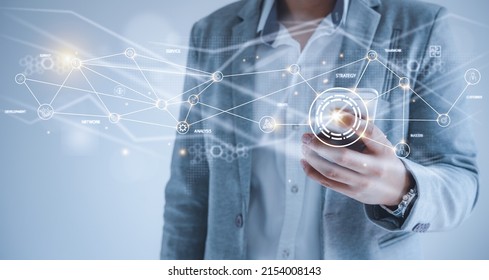 Human using mobile phone technology to analyze growing  statistics business of graph or chart . management goal strategy and action plan. Global customer network connection  on virtual interface. - Shutterstock ID 2154008143