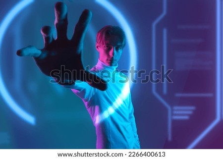 human vs hi-tech machine with the ability of deep learning while man hold hand to interactive virtual touch graphic  and try to understand the ai innovation of the future