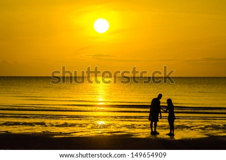 Human walk on the beach in twilight time